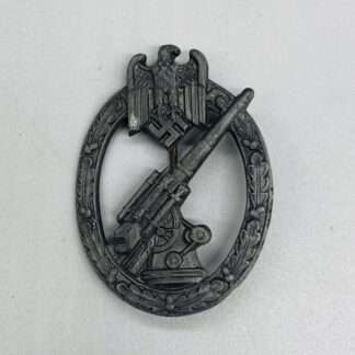 A WW2 German Heer Flak Badge By C.E. Juncker, constructed in zinc.