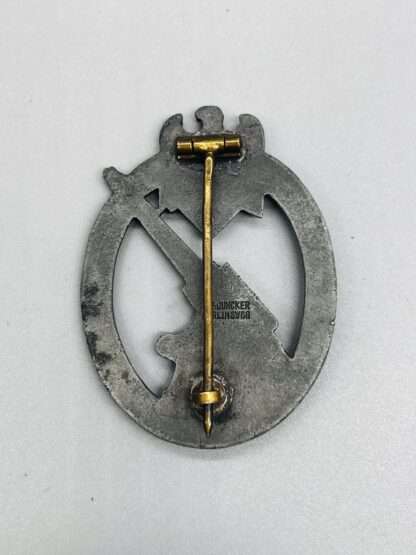 Reverse image of a WW2 German Heer Flak Badge By C.E. Juncker, constructed in zinc with makers mark.