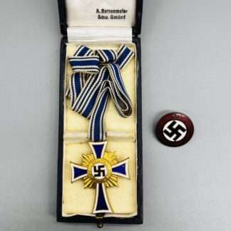 A WW2 German Mother's Cross Gold with presentation case and NSDAP pin.