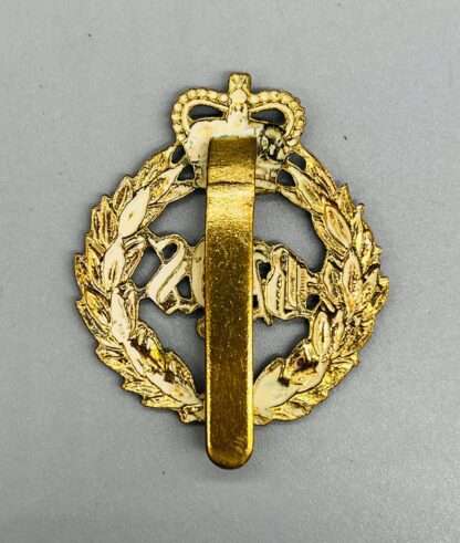 A reverse image 2nd Dragoon Guards (Queens Bays) regimental cap badge, die-stamped in brass with slider.