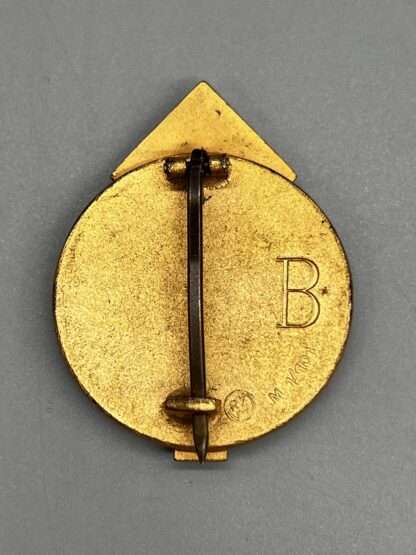 A reverse image of Hitler Youth Golden Leaders Sports Badge marked B and RZM M1/101