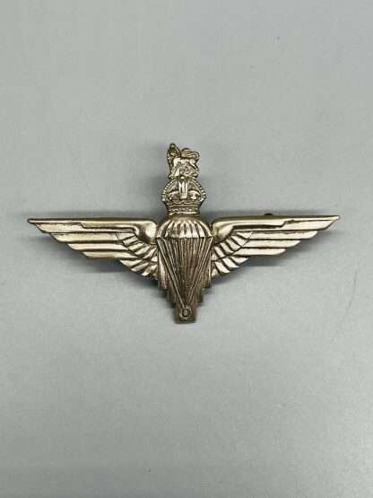 A British WW2 Parachute Regiment Cap Badge, constructed in white metal.