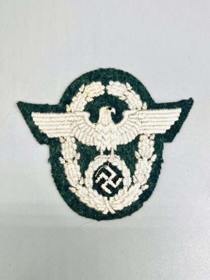 A reverse image of a WW2 German Police Administration EM/NCO Sleeve Eagle