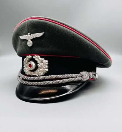 A stunning WW2 German Army (Heer) Panzer Officers Visor Cap with insignia, with silver bullion cord chin strap.