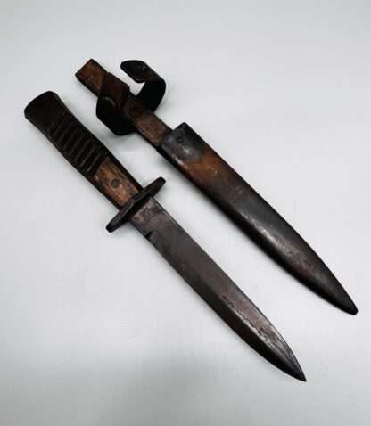 A WW1 German Close Combat Boot Knife By Gottlieb Hammesfahr, with scabbard.
