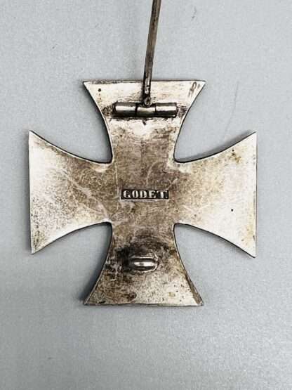 A reverse image of a Iron Cross 1870 1st Class stamped Godet, with barrel hinge and flat wire catch.