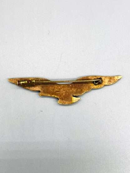 A reverse image of WW2 RAF Pathfinder Badge constructed in brass, with horizontal pin assembley.