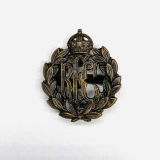 Original Royal Flying Corps cap badge constructed in bronze with RFC monogram surrounded by a laurel wreath and surmounted by a Kings crown.