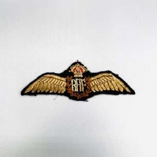 An orginal WW2 Royal Air Force Pilot Wings with RAF monogram in the centre with outstreached wings, surmounted by a Kings crown in red thread.