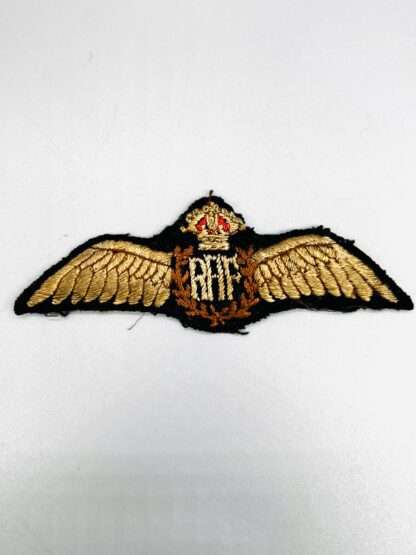 An orginal WW2 Royal Air Force Pilot Wings with RAF monogram in the centre with outstreached wings, surmounted by a Kings crown.