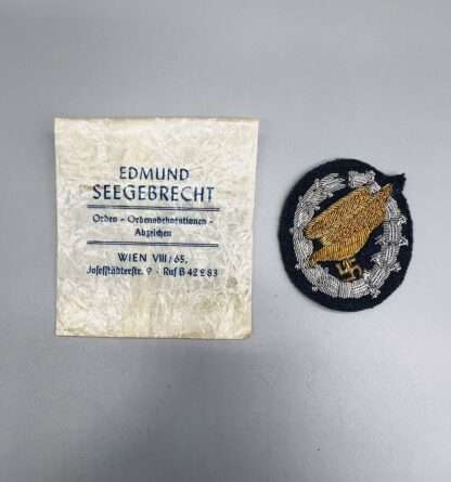An original Luftwaffe Fallschirmjäger Officer's Cloth Badge, and packet.