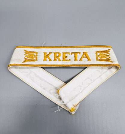 An original Kreta cuff title (Ärmelband) constructed in white cotton.
