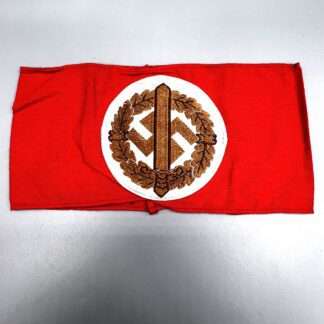 A reverse image of a German SA Sports armband, bevo construction on red cotton.