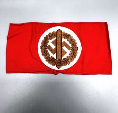 A reverse image of a German SA Sports armband, bevo construction on red cotton.
