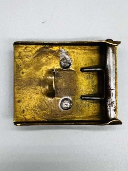 Reverse image of a German Third Reich SA belt buckle, constructed in brass.