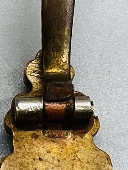 A close up image of the hinge for WW2 Luftwaffe Reconnaissance Clasp bronze, constructed in tombac unmarked but attributed to C.E. Juncker, Berlin.
