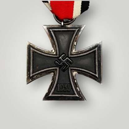 An Iron Cross 2nd Class Medal with original ribbon.