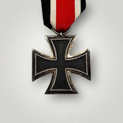 Revesre image of an Iron Cross 2nd Class Medal with original ribbon.