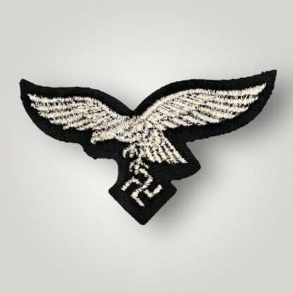 A revesre image of a WW2 Luftwaffe EM/NCO's Herman Göring Panzer-Division breast eagle, machine embroidered.
