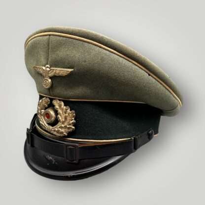 A WW2 German Heer infantry EM/NCO's visor cap, with green central band with wihite pipping.
