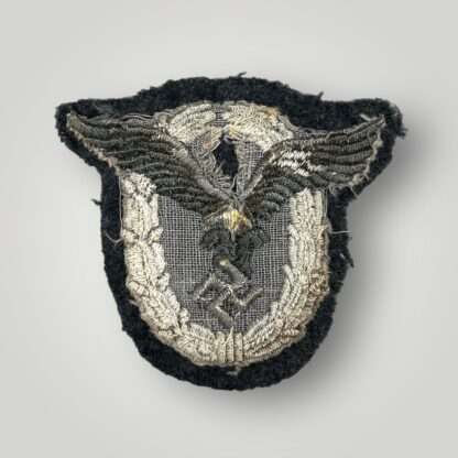 Reverse photo of a Luftwaffe Pilots Cloth Badge, machine embroidered.