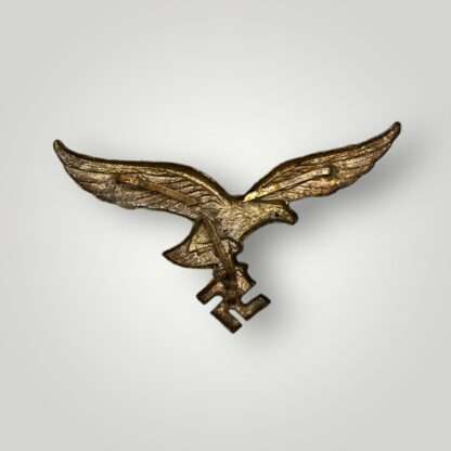 Reverse photo of a Luftwaffe tropical pith helmet eagle, die struck in aluminium.