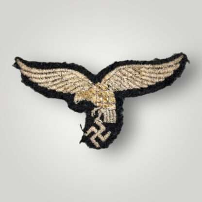 Reverse photo of an early Luftwaffe breast eagle 'droop tail' version.