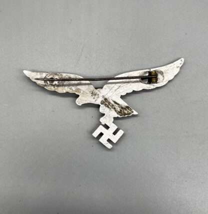 Reverse image of a Luftwaffe Officer's summer breast eagle, with missing catch.