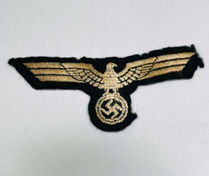 A Heer (Army) EM/NCO's breast eagle, machine embroidered on green wool.