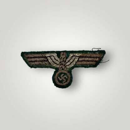 A WW2 Heer officers bullion breast tunic eagle, on green woollen backing.