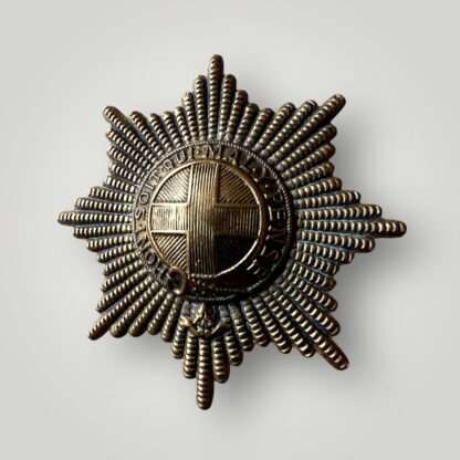 A brass Coldstream Guards WW2 cap badge.