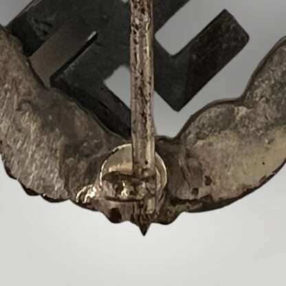 A close up image of the catch for a Luftwaffe Observer's Badge by Assmann & Söhne.