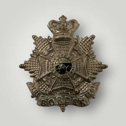 An original Border Regiment Victorian cap badge, constructed in white metal.