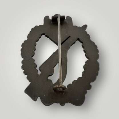 A reverse image of an original Infantry Assault Badge silver by Funcke & Brüninghaus, constructed in zinc with crimped barrel hinge, flat wire catch.