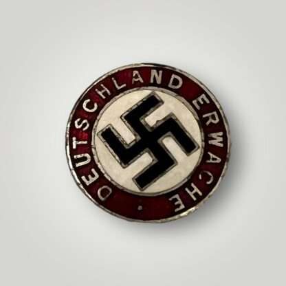 A scarce NSDAP Deutschland Erwache pin, constructed in enamel.