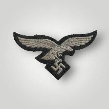 A Luftwaffe EM/NCOs Breast Eagle Unissued, machine embroiderd.