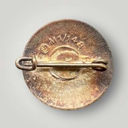 An original NSDAP party pin late war painted badge M1/148, with makers mark and safety pin catch.