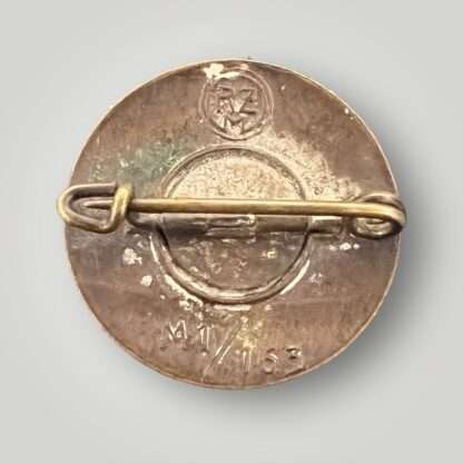Reverse image of an original NSDAP Party Badge Marked Gesh & Gesch, with safety pin.