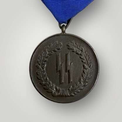 A SS service medal four years complete with original ribbon