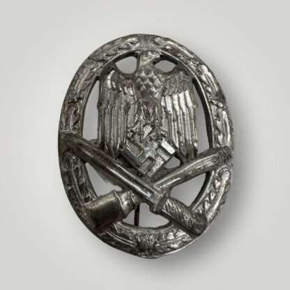 An orginal General Assault Badge by Rudolf Karneth, constructed in silvered zinc.