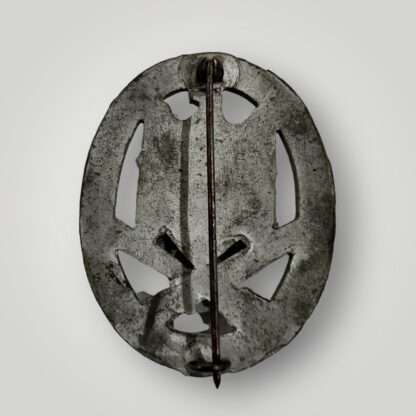 A reverse image of an orginal General Assault Badge by Rudolf Karneth, constructed in silvered zinc.