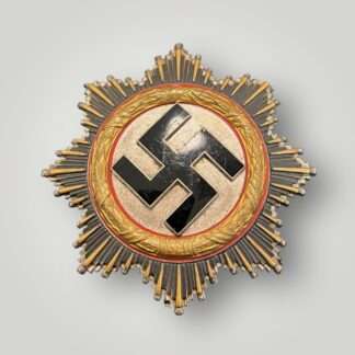 A WW2 German Cross in Gold by Zimmerman placed in the presentation case.