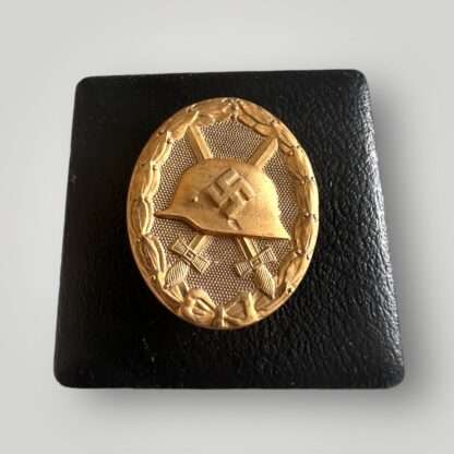 An original WW2 German Gold Wound badge tombak by Karl Wild, constructed in tombak with presentation case.