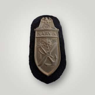 An original Kriegsmarine Narvik Shield, with dark blue backing cloth.