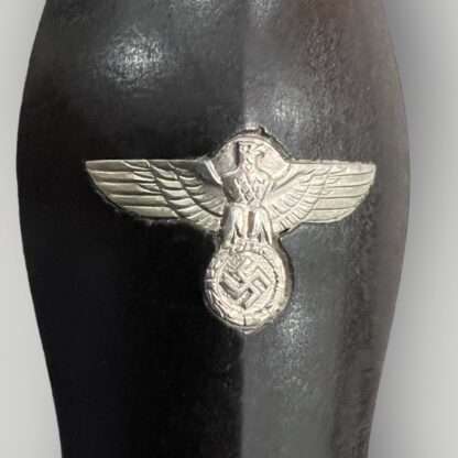 A close up image of a SS M33 Dagger grip eagle.