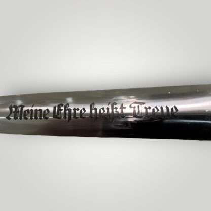 A close up image of a SS M33 Dagger inscription 'Meine Ehre heißt Treue' by Boker.