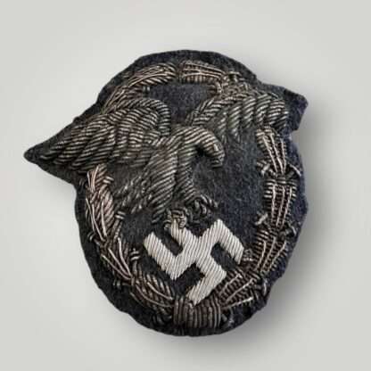 A rare Luftwaffe Officers Observer's Bullion Badge, hand embroidered with silver and black bullion wire on blue wool backing.