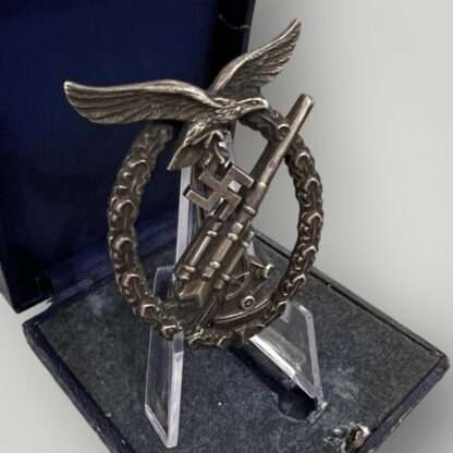 An original Luftwaffe Flak Badge By C.E. Juncker with presentation case.