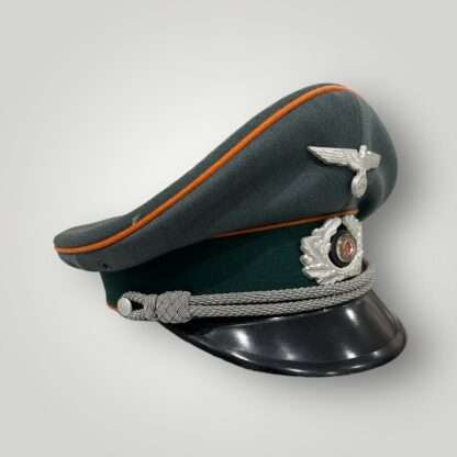 A Heer Feldgendarmerie Officer's visor cap, with silver bullion chin strap.