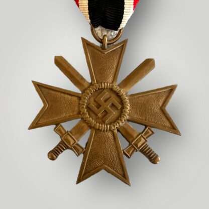 A WW2 War Merit Cross with swords 2nd class By grossmann & co, with original ribbon.